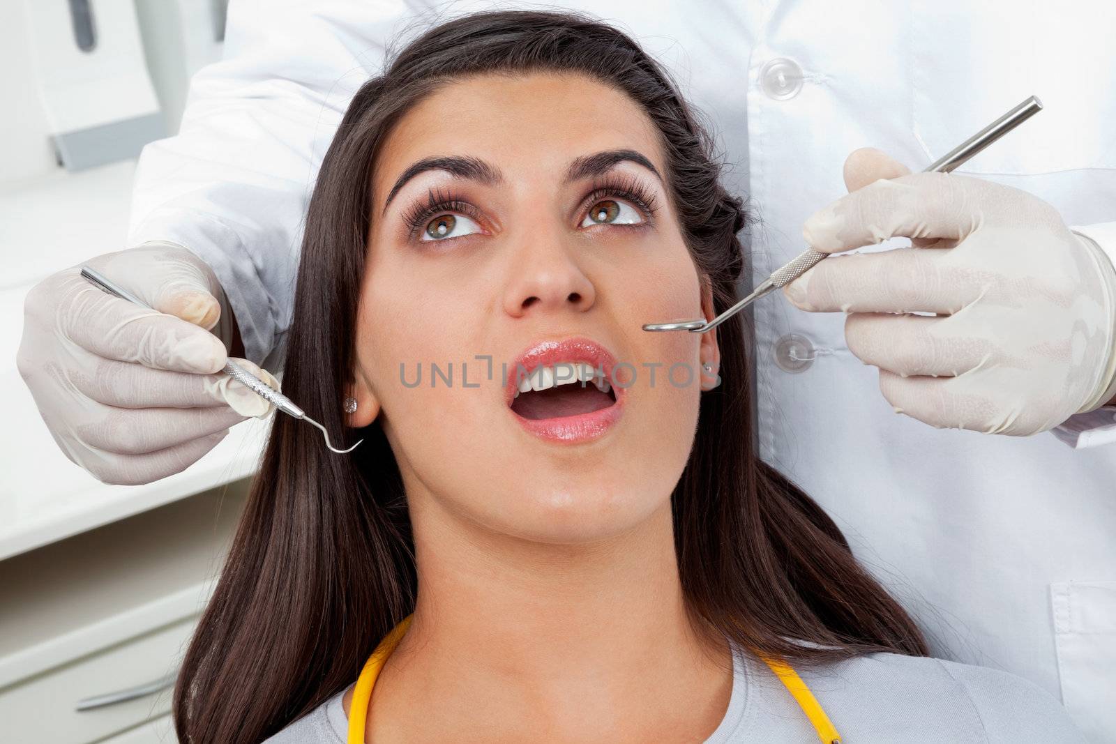 Patient Having Her Teeth Examined by leaf