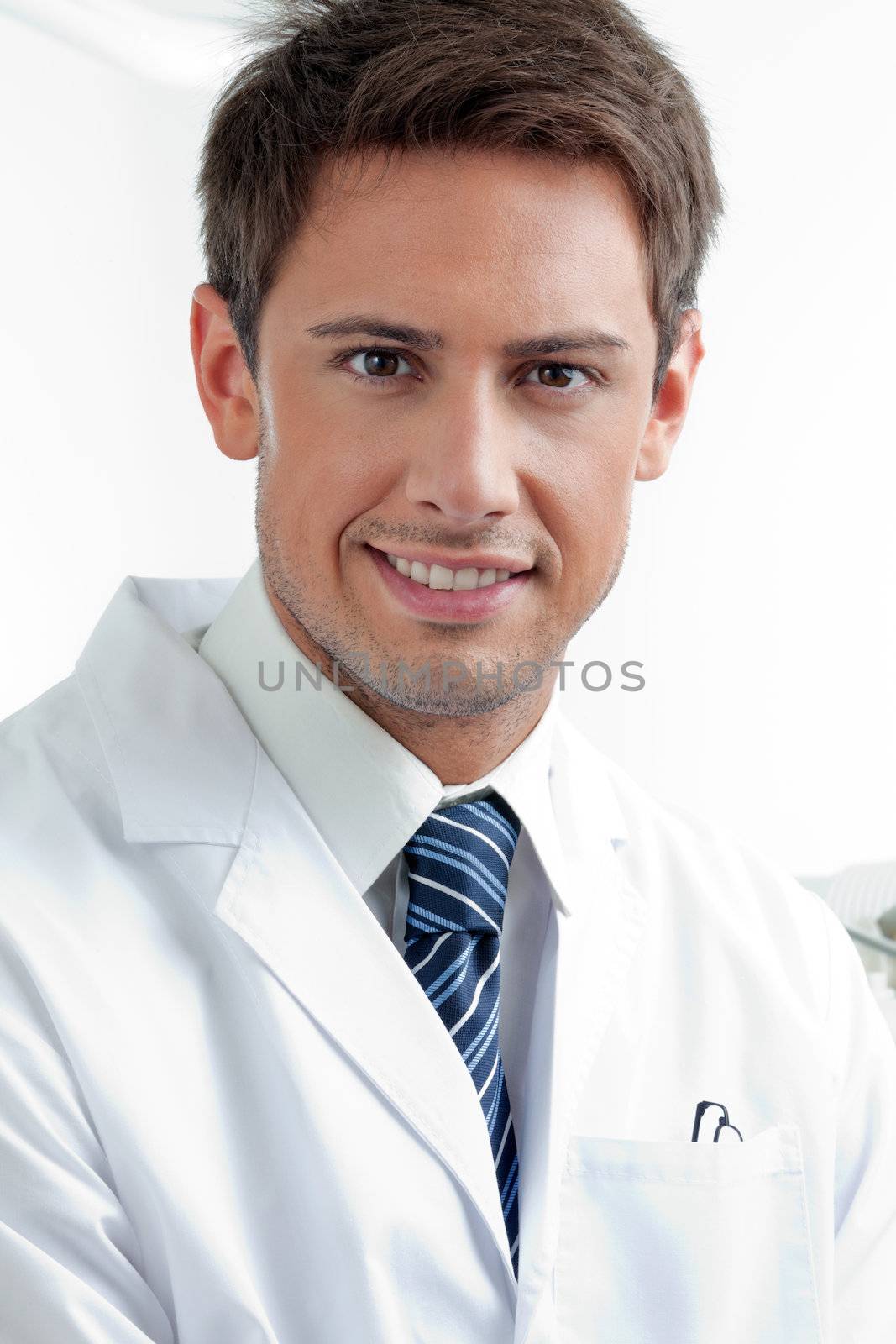 Closeup portrait of male dentist smiling