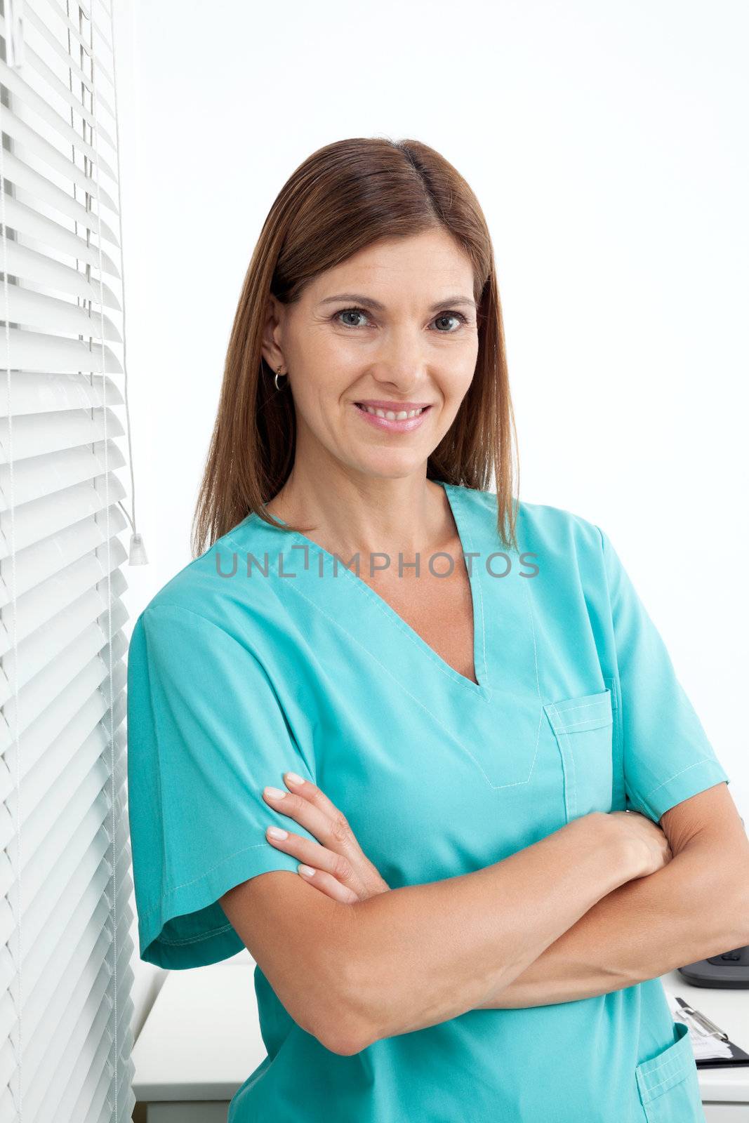 Confident Female Dentist In Clinic by leaf