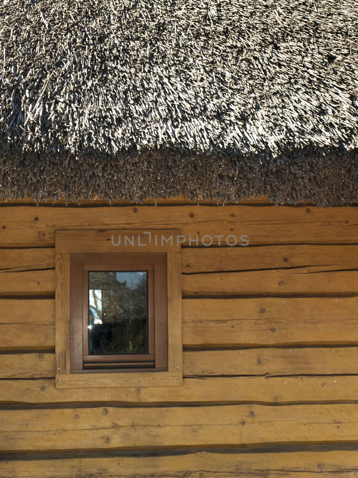 Wooden House With Thatch Roof and Small Window