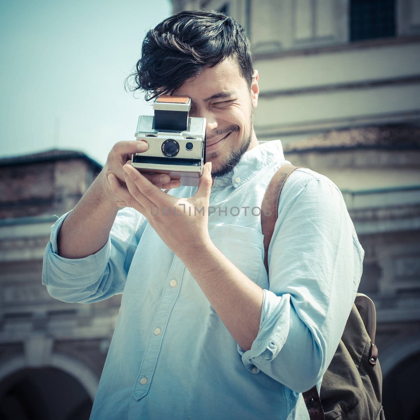 stylish man in the street with old camera  by peus