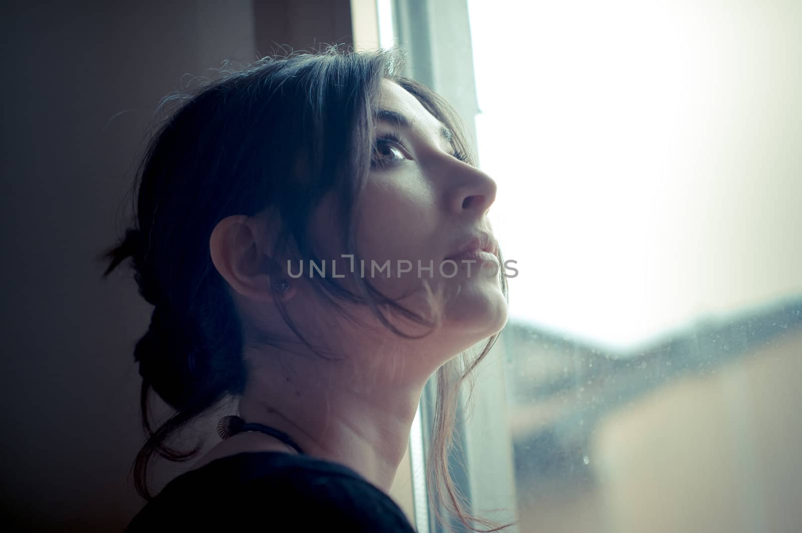 beautiful woman at home near window