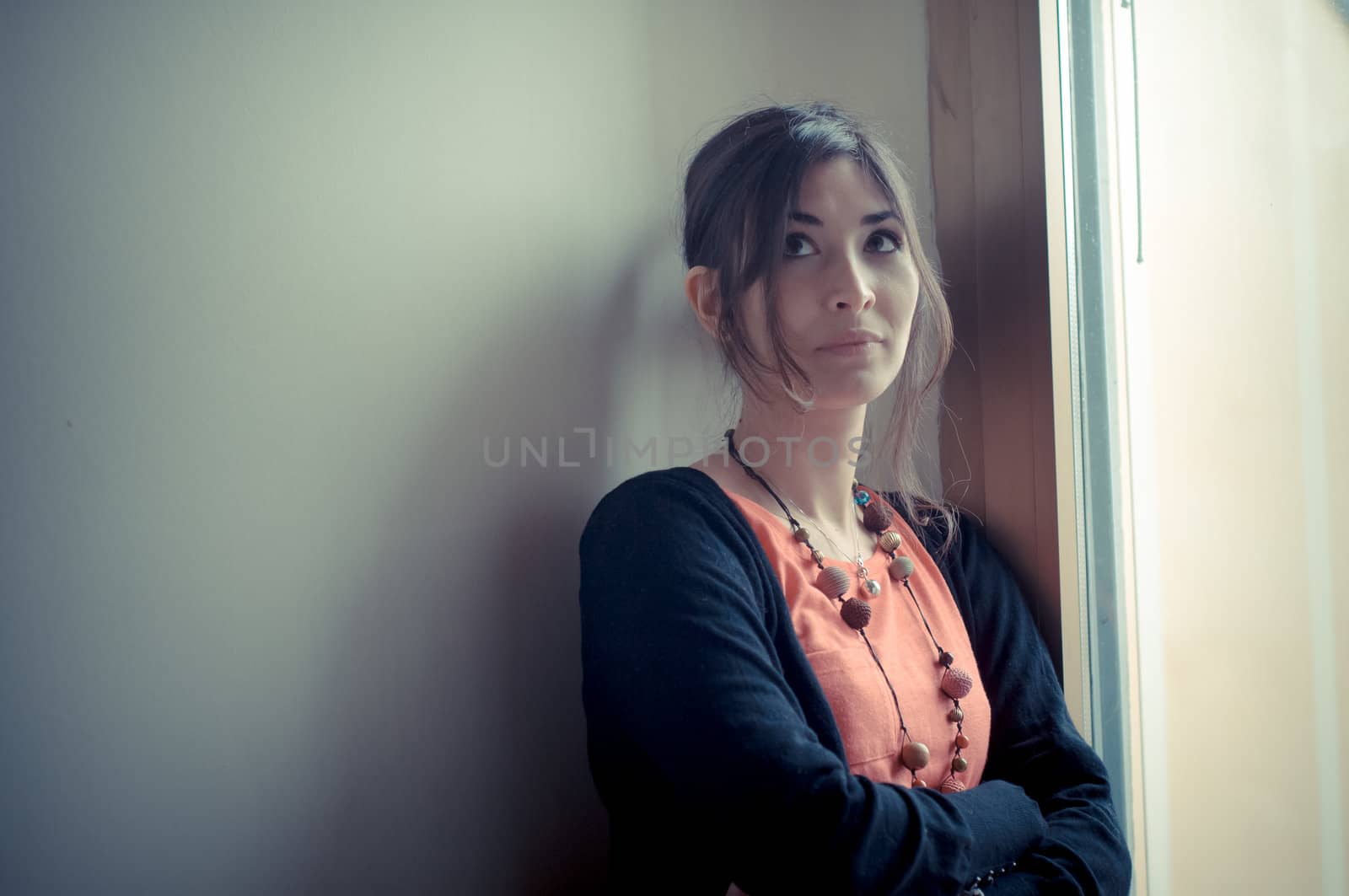 beautiful woman at home near window