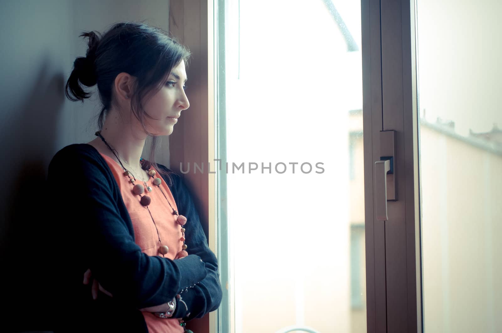 beautiful woman at home near window