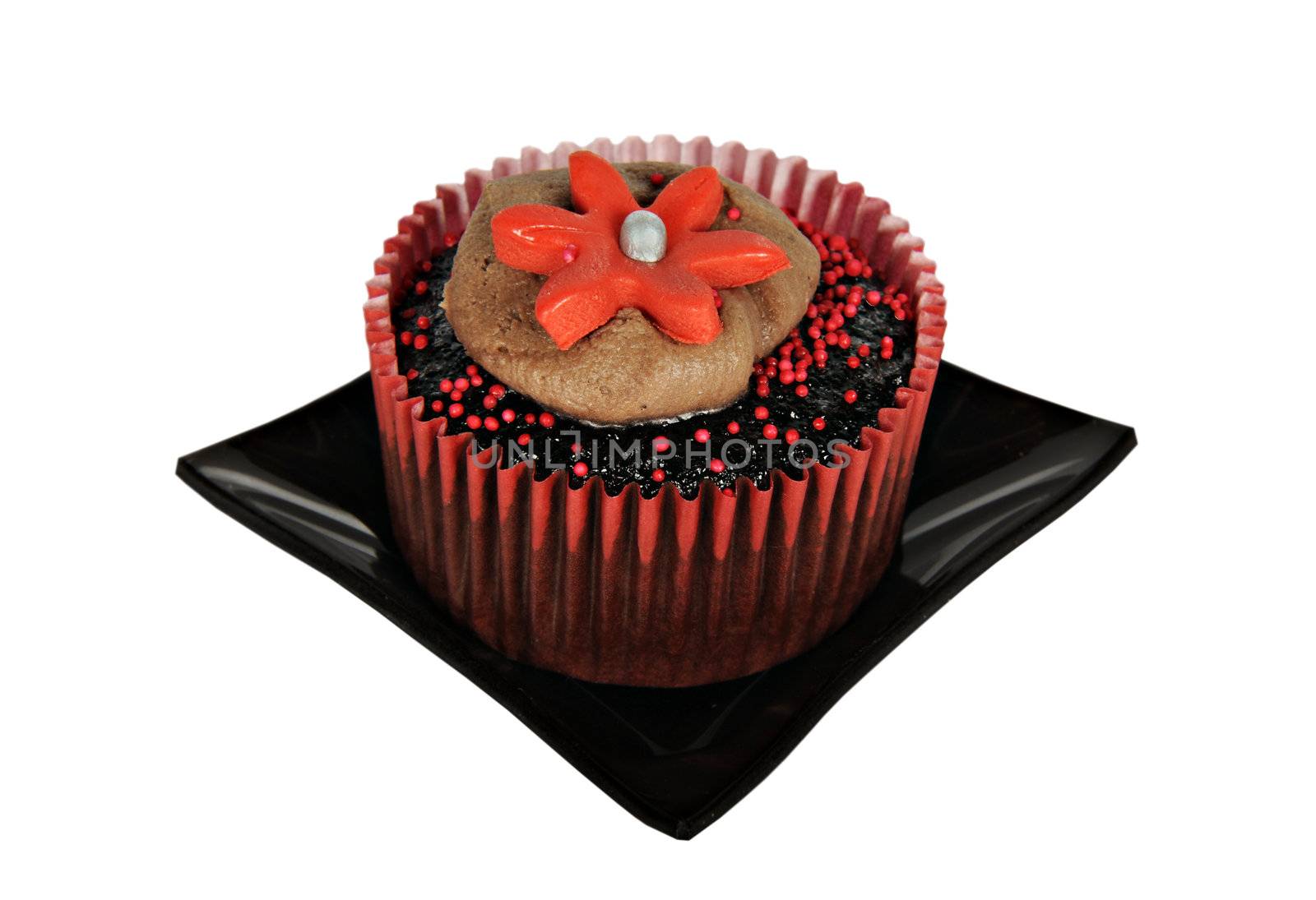 One chocolatecupcake with red icing on a black plate on pure white background