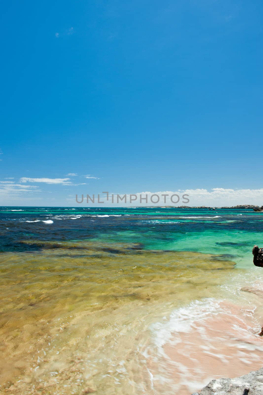 Image of seascape over the blue sky background