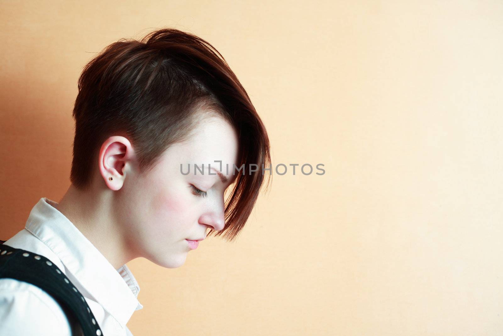 Portrait of beautiful young girl with modern coiffure