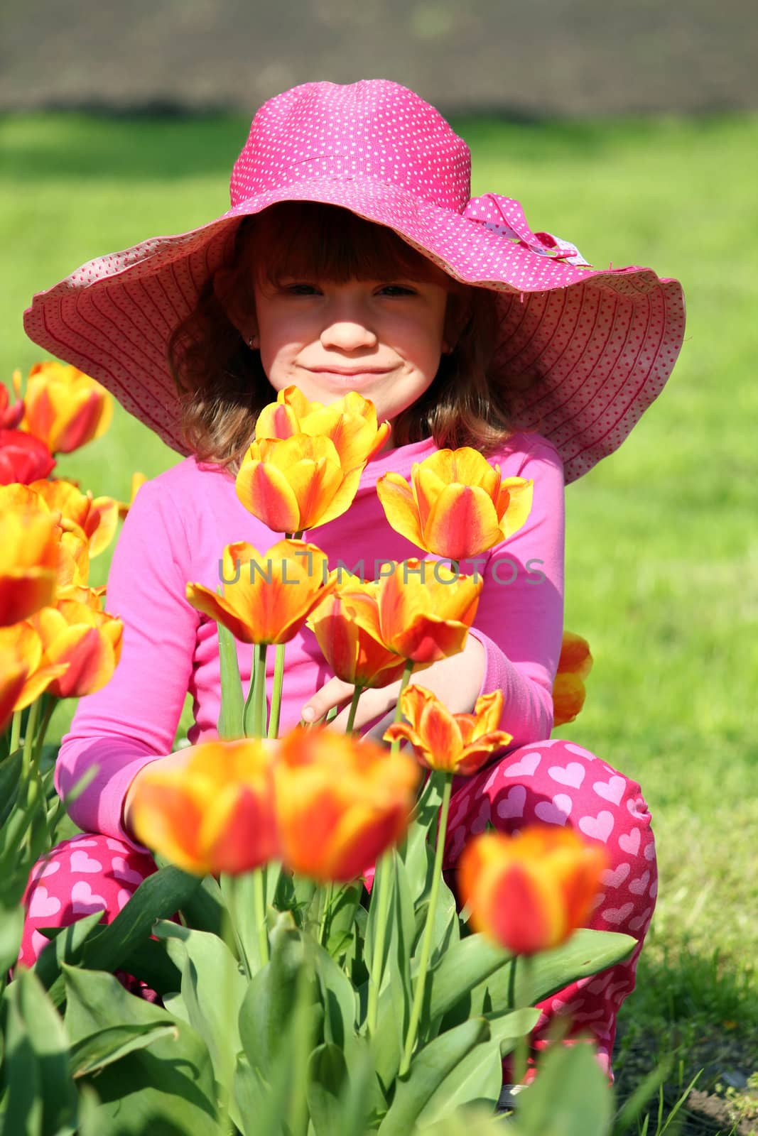 little girl with tulip flowers