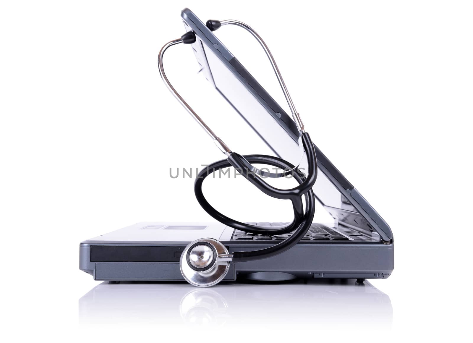 Stethoscope and laptop in profile isolated on white background