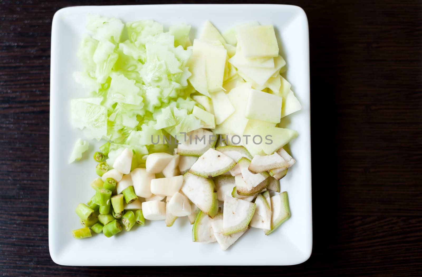 vegetable sliced on white dish by moggara12