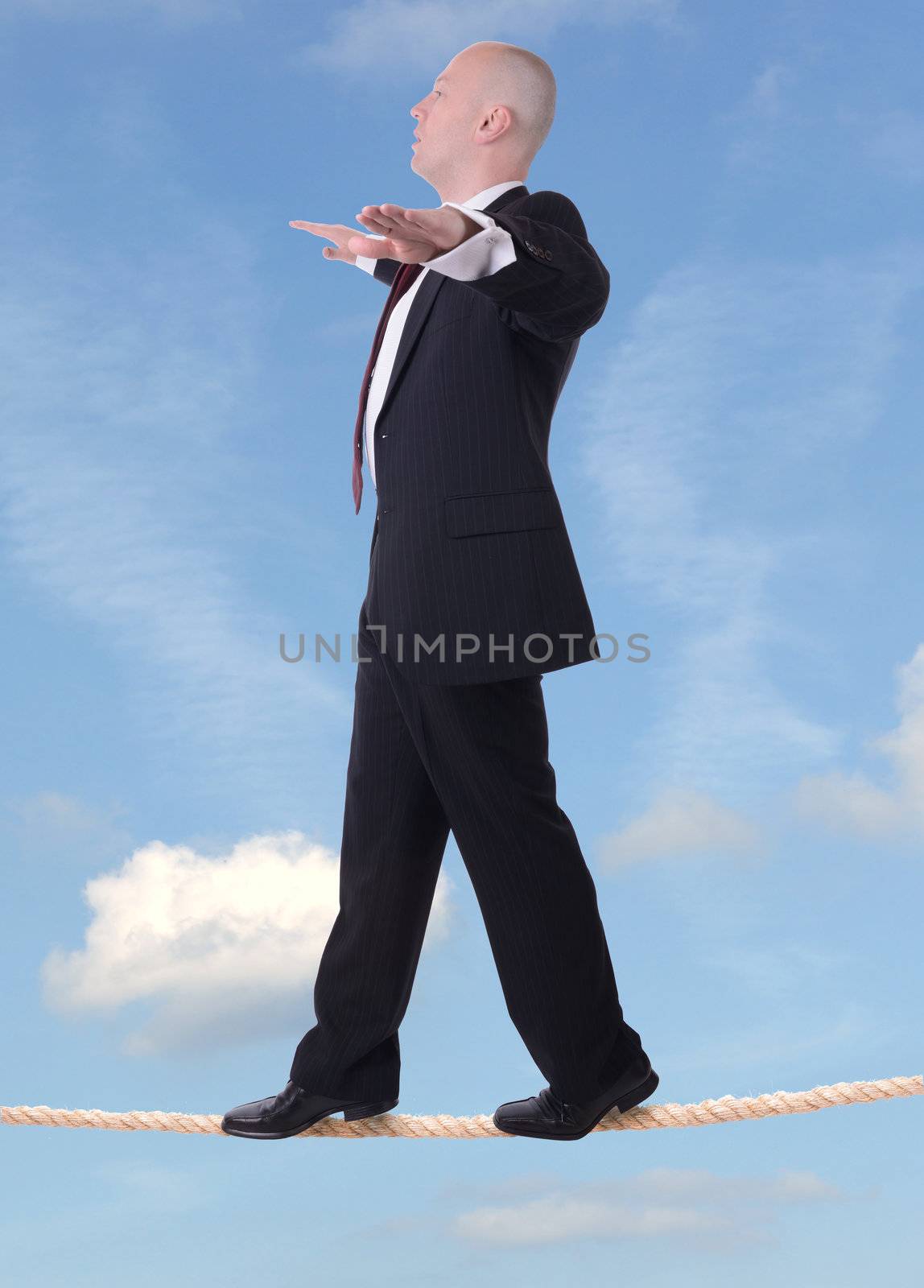 businessman tightrope sky by hyrons