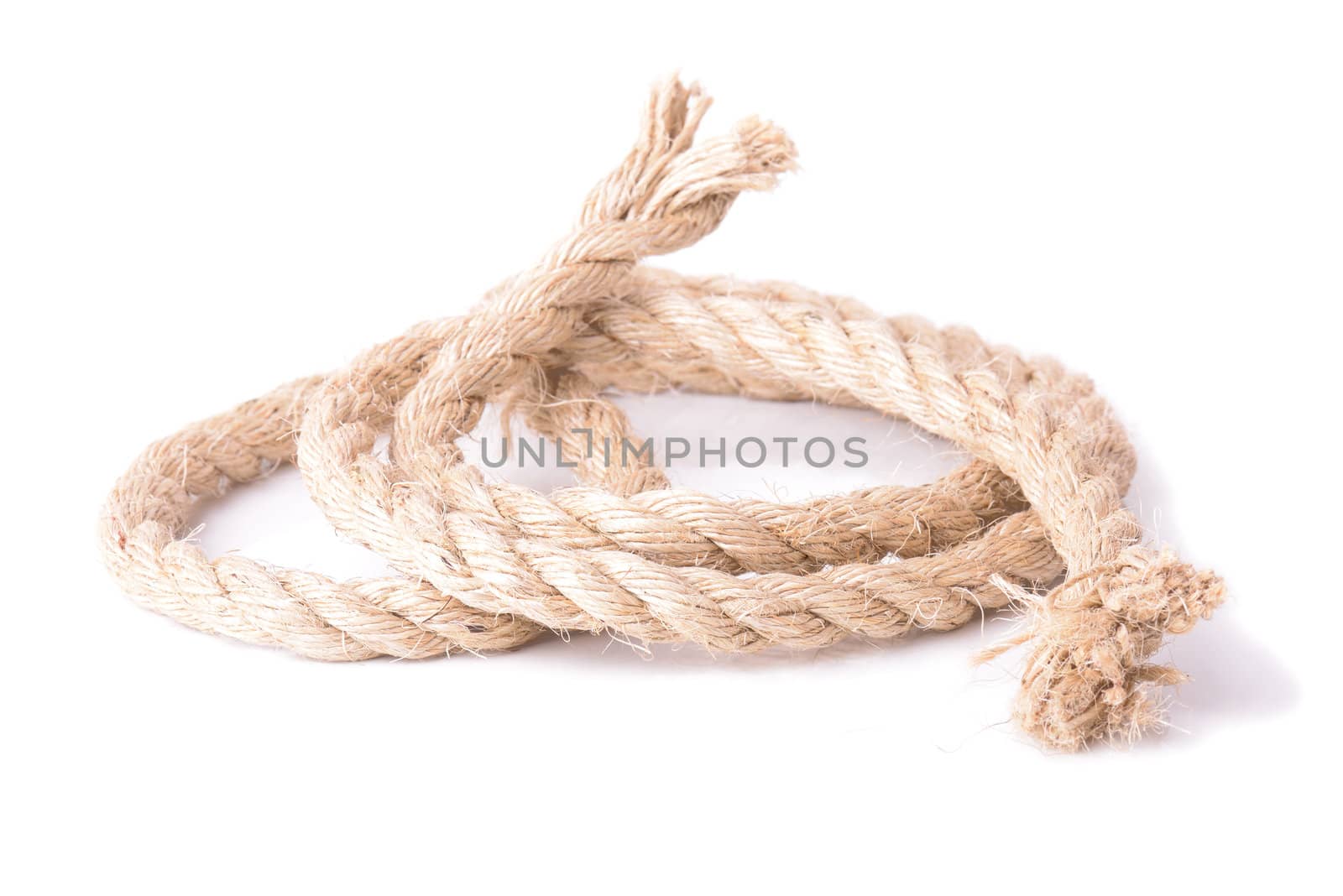 a coil of large diameter natural rope on white background