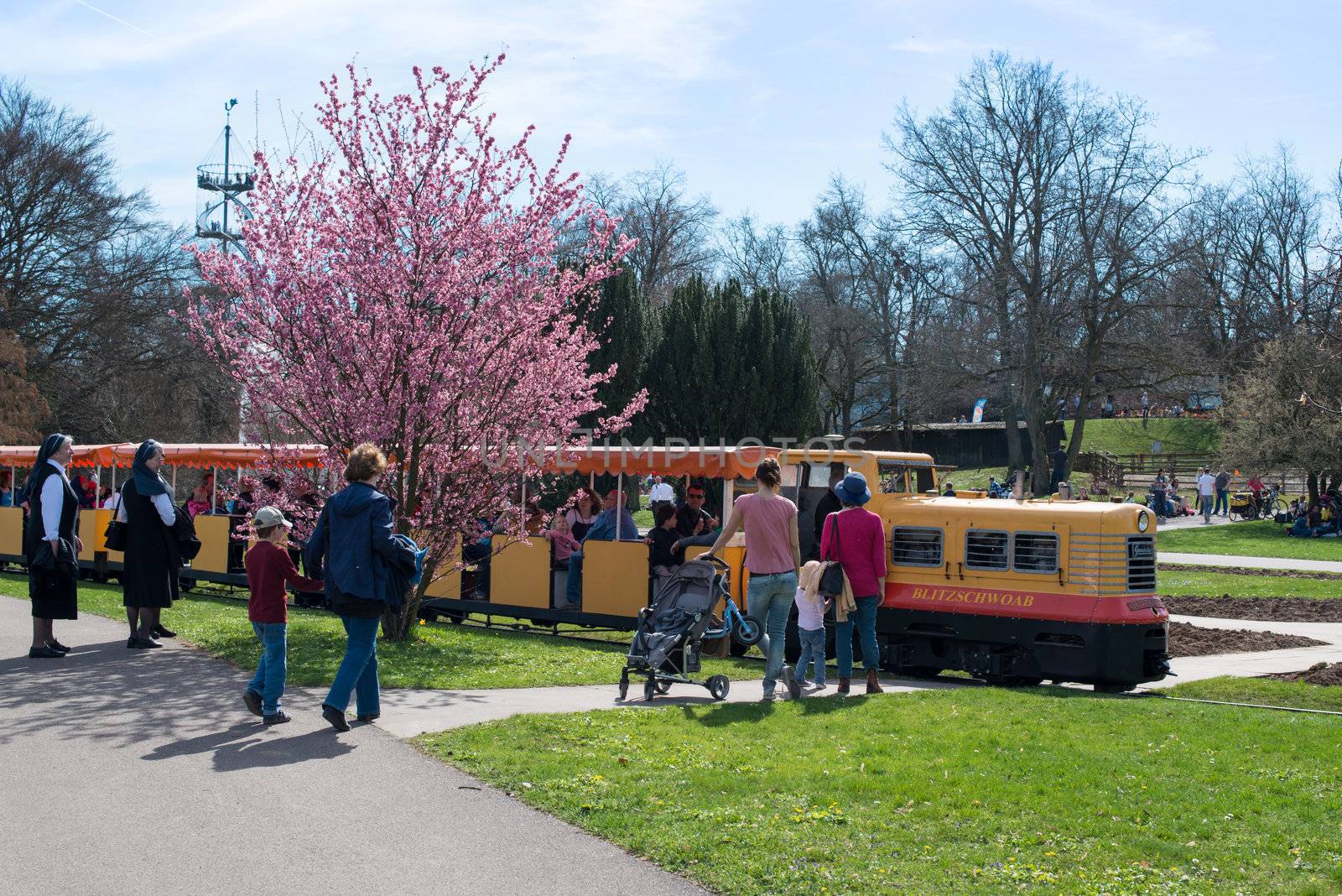 STUTTGART, GERMANY - April 14, 2013: People are enjoying the first sunny spring day in Killesberg Park in Stuttgart, Germany on April 14, 2013. Killesberg Park was opened 1939 and is with its about 50 hectares an important recreation area for inhabitants and a great sight for tourists of Stuttgart.