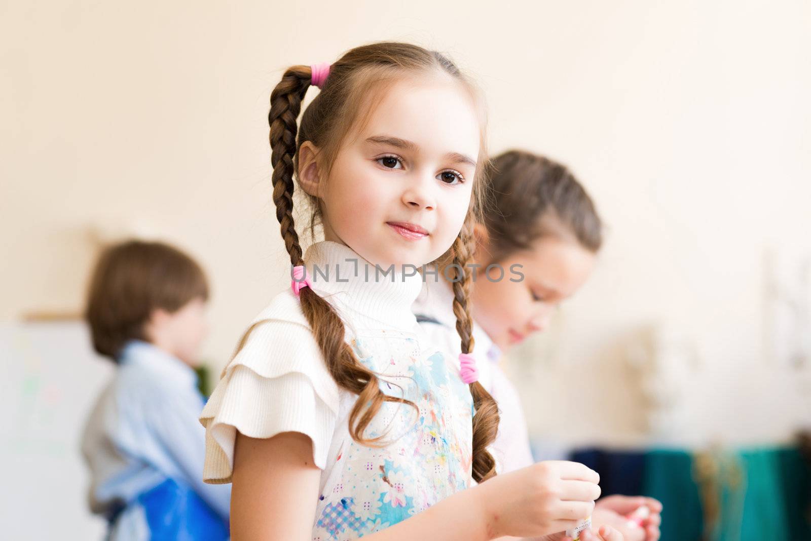 portrait of a girl in an apron, the kids involved in art school