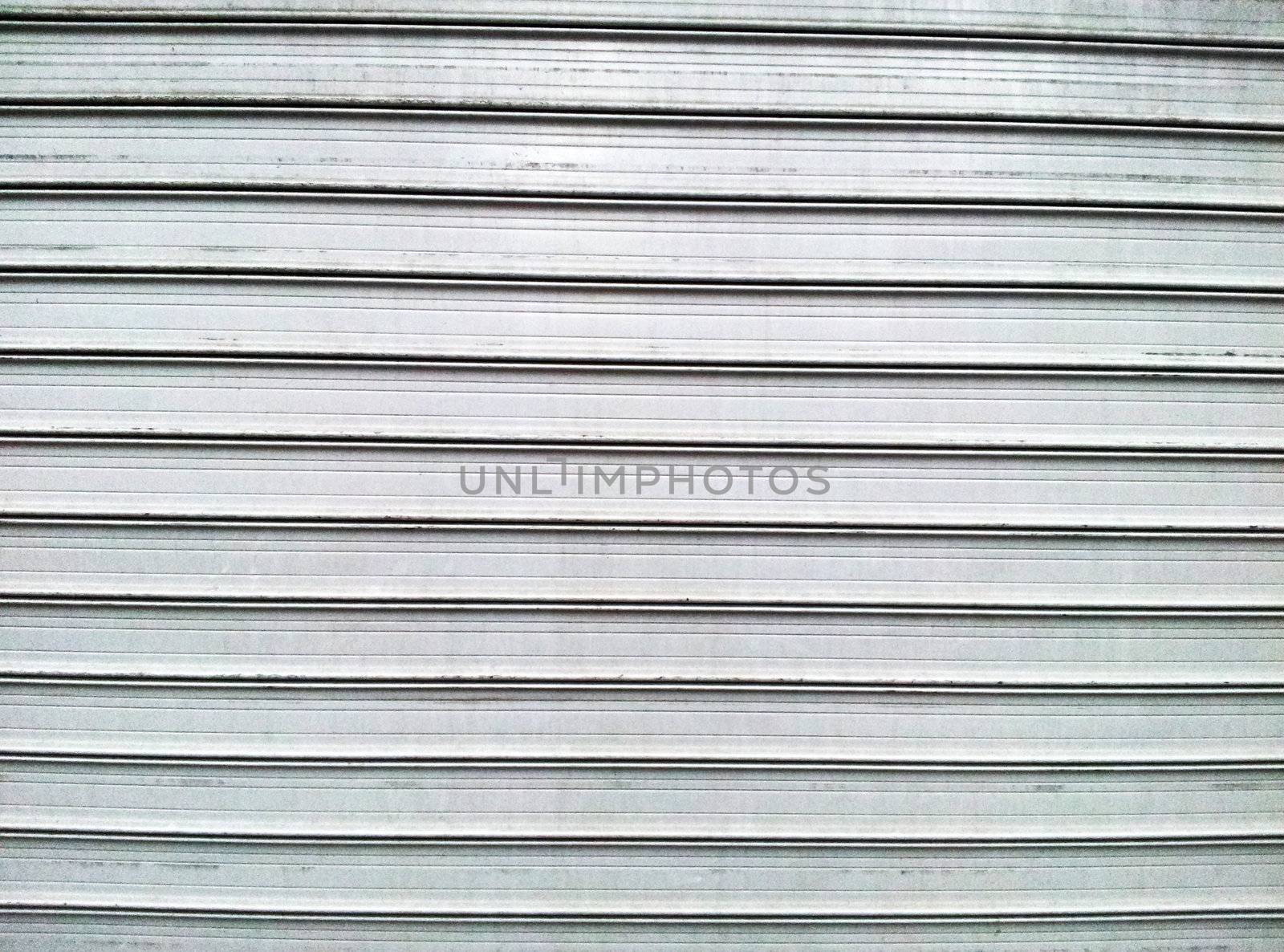Gray steel garage door with horizontal lines