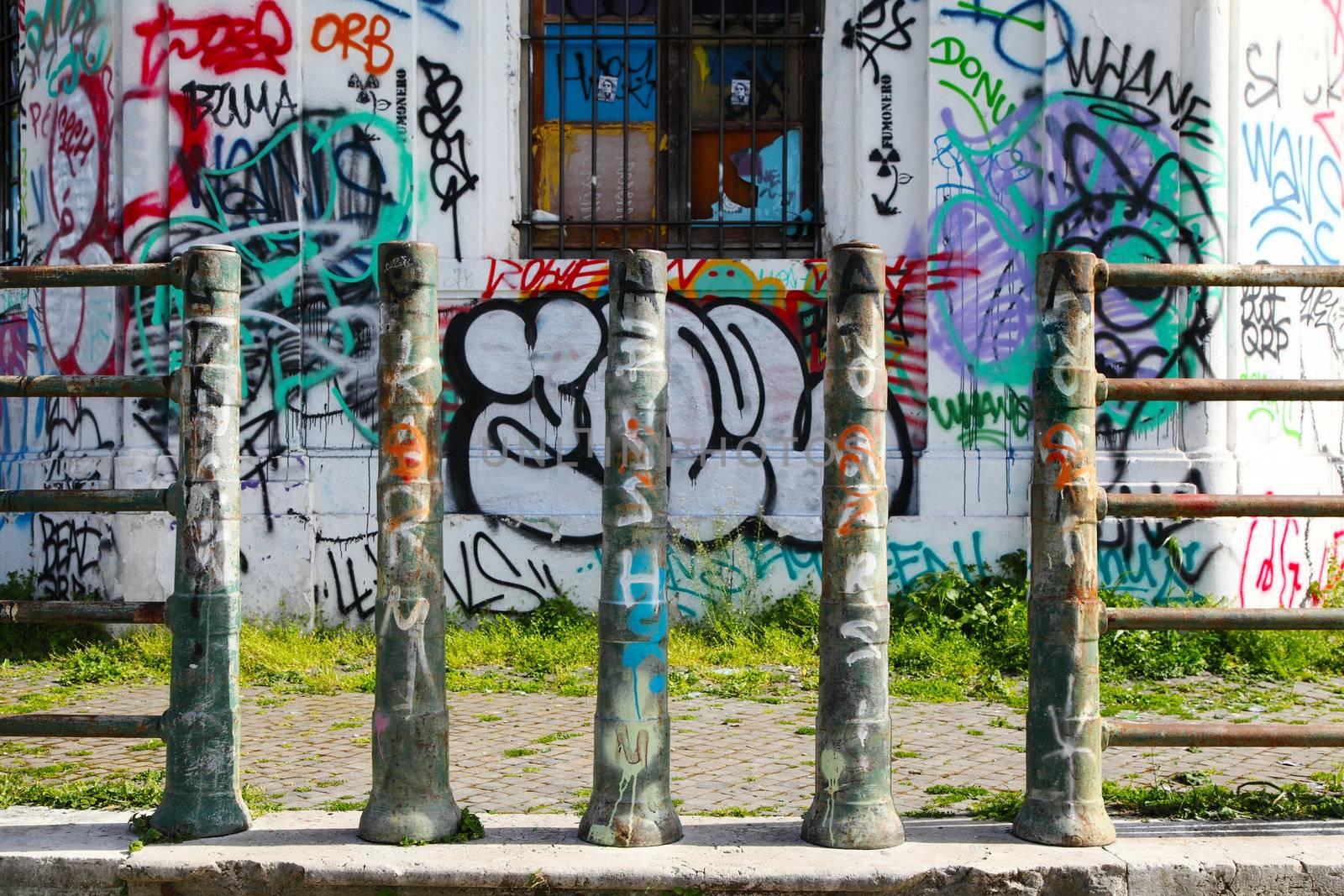 Graffiti art on doors in Rome street