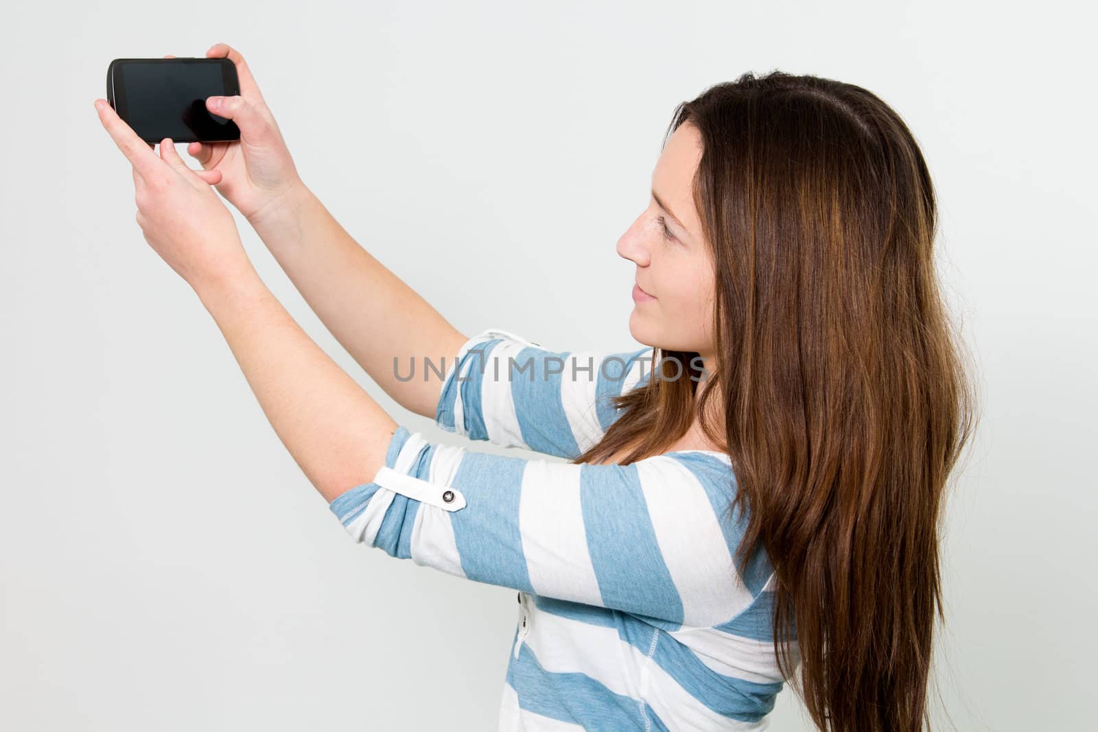 Brunette Girl using a Smartphone by dwaschnig_photo