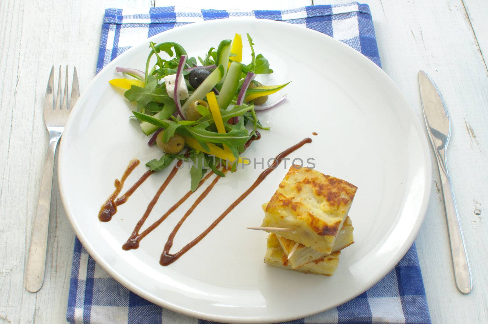 Spanish omelette with salad  by unikpix