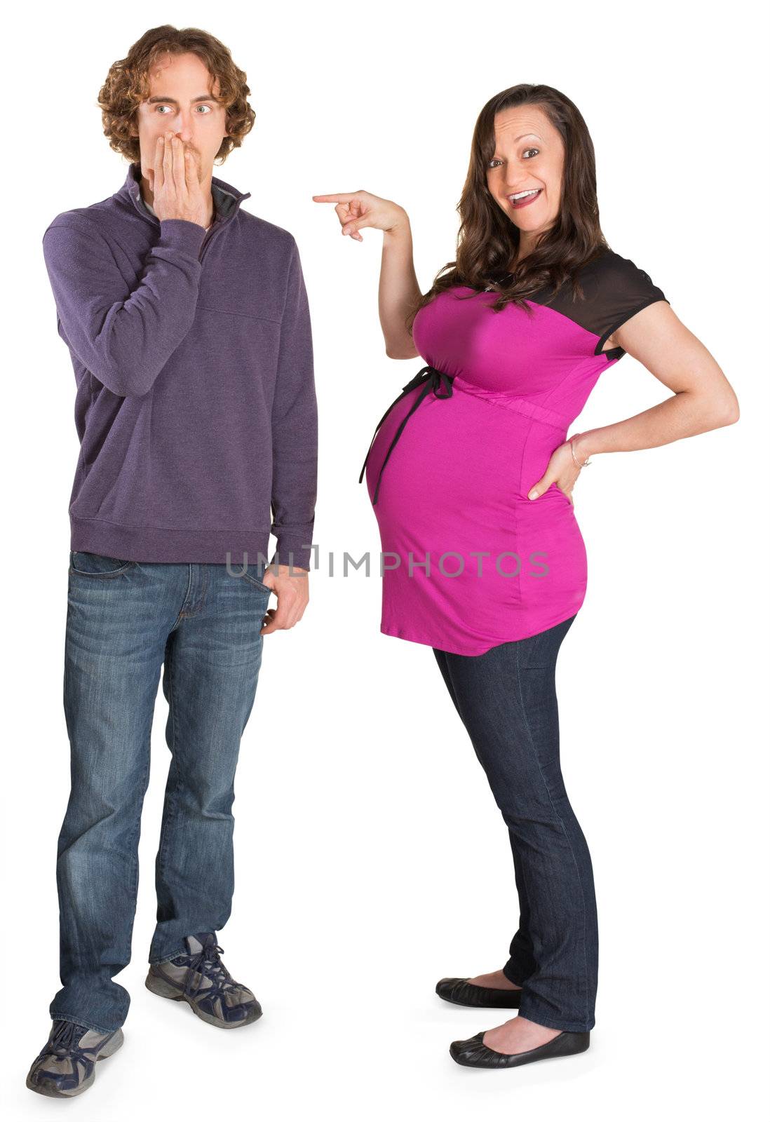 Man covering mouth as pregnant woman points at him