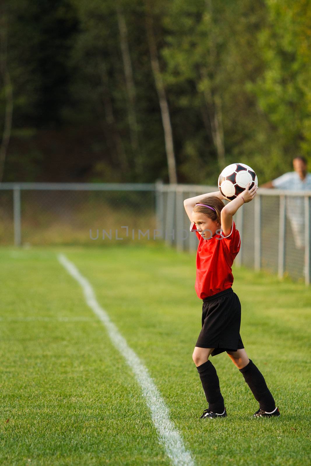 Young girl with a soccer ball