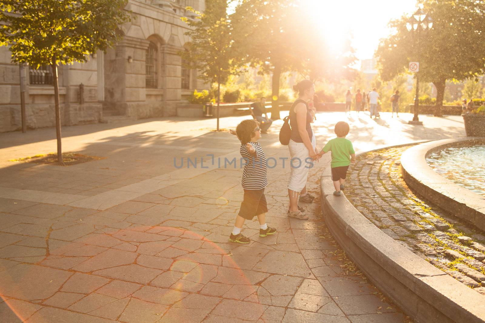 Family walking in downtown Montreal at sunset