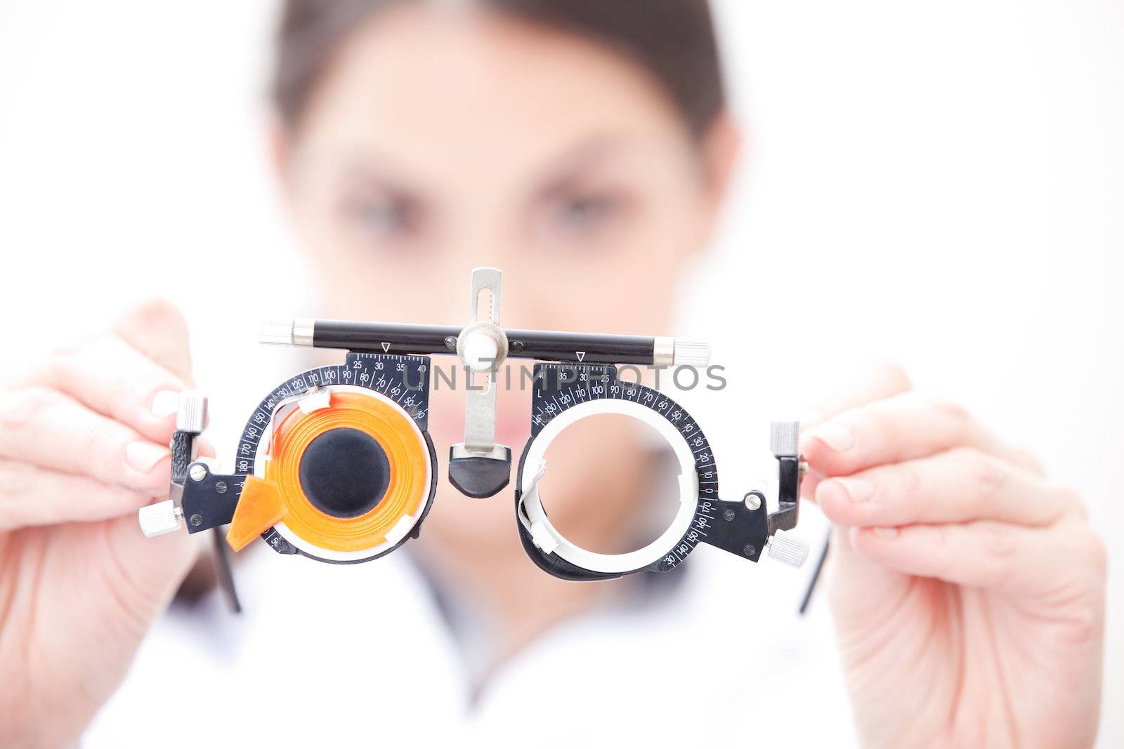 Optometrist holding a eye test glasses.
