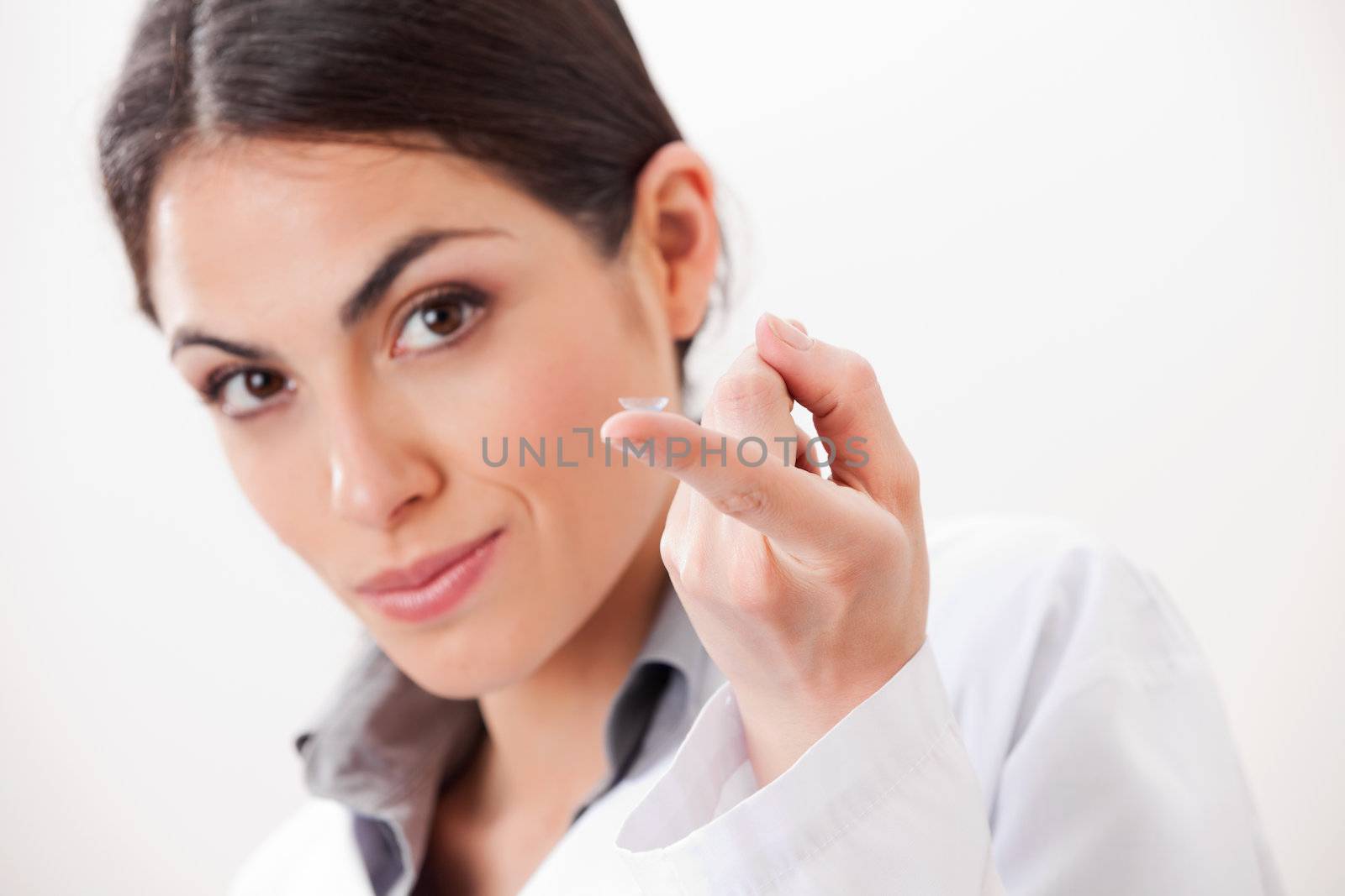 Female Optometrist With Contact Lens by leaf