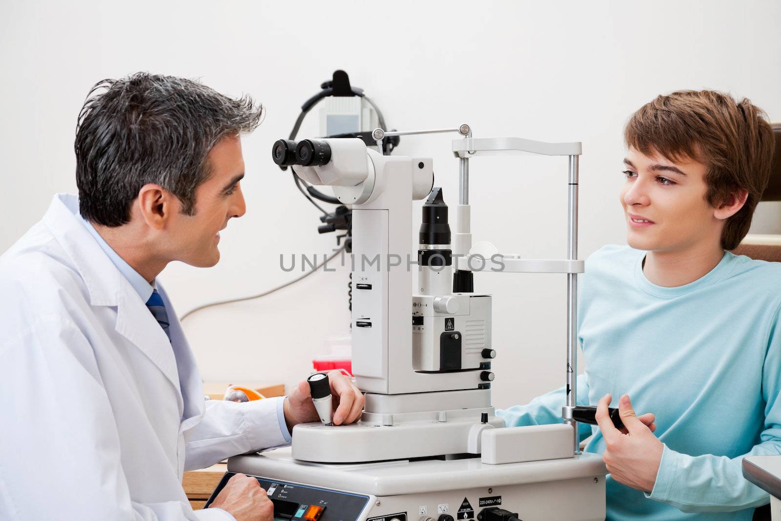 Boy Consulting Doctor After Visual Field Test by leaf