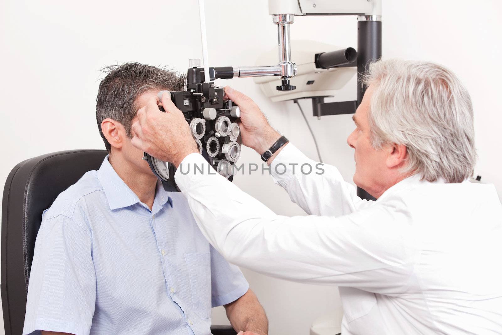 Optometrist Doing Sight Testing by leaf