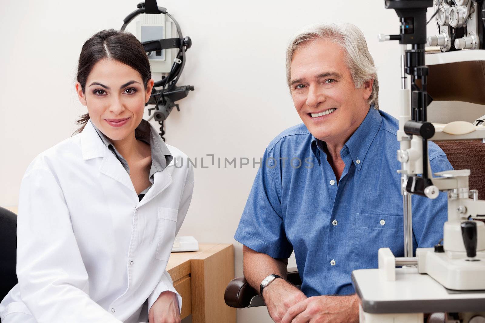 Smiling Optometrist With Her Patient by leaf