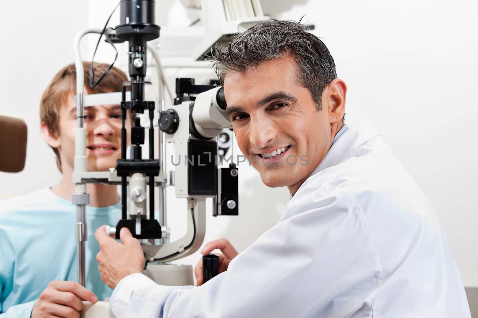 Optometrist Doing Visual Field Test On His Patient by leaf