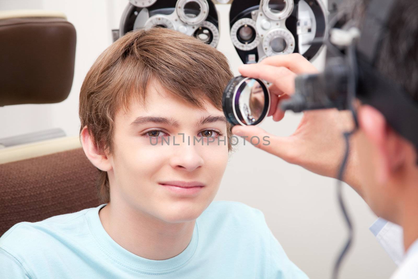 Optometrist taking an eyesight test examination.