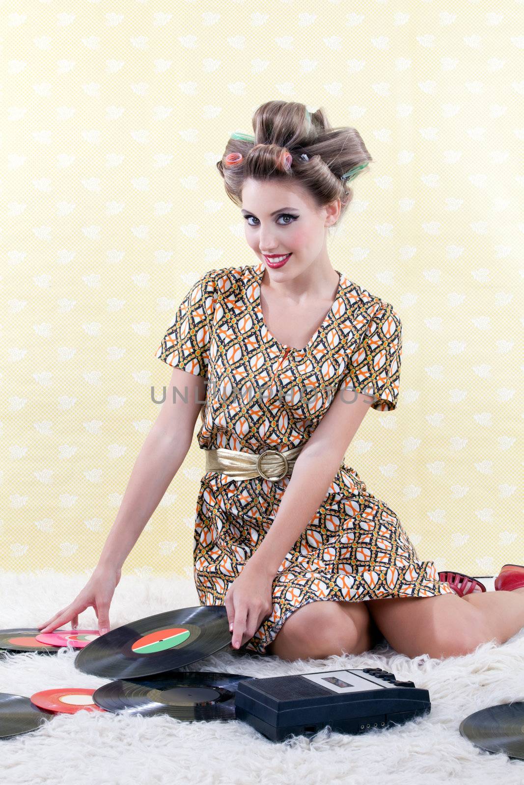 Woman with vinyl record on white carpet.