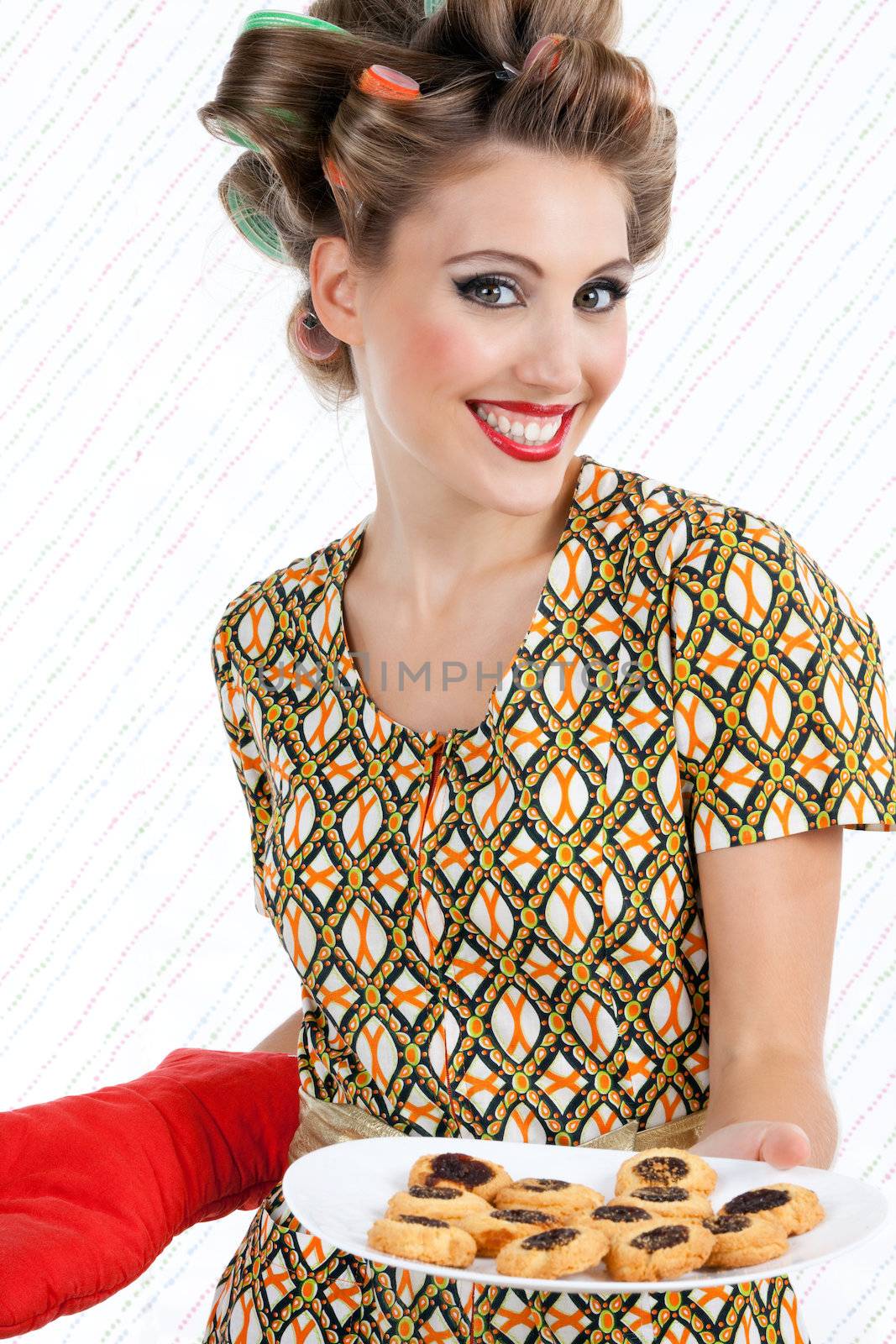 Portrait of attractive retro woman with cookies