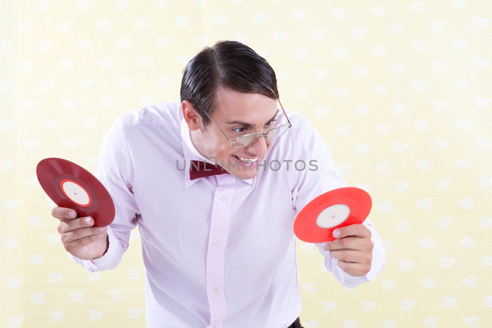 Excited nerdy geek with vinyl record