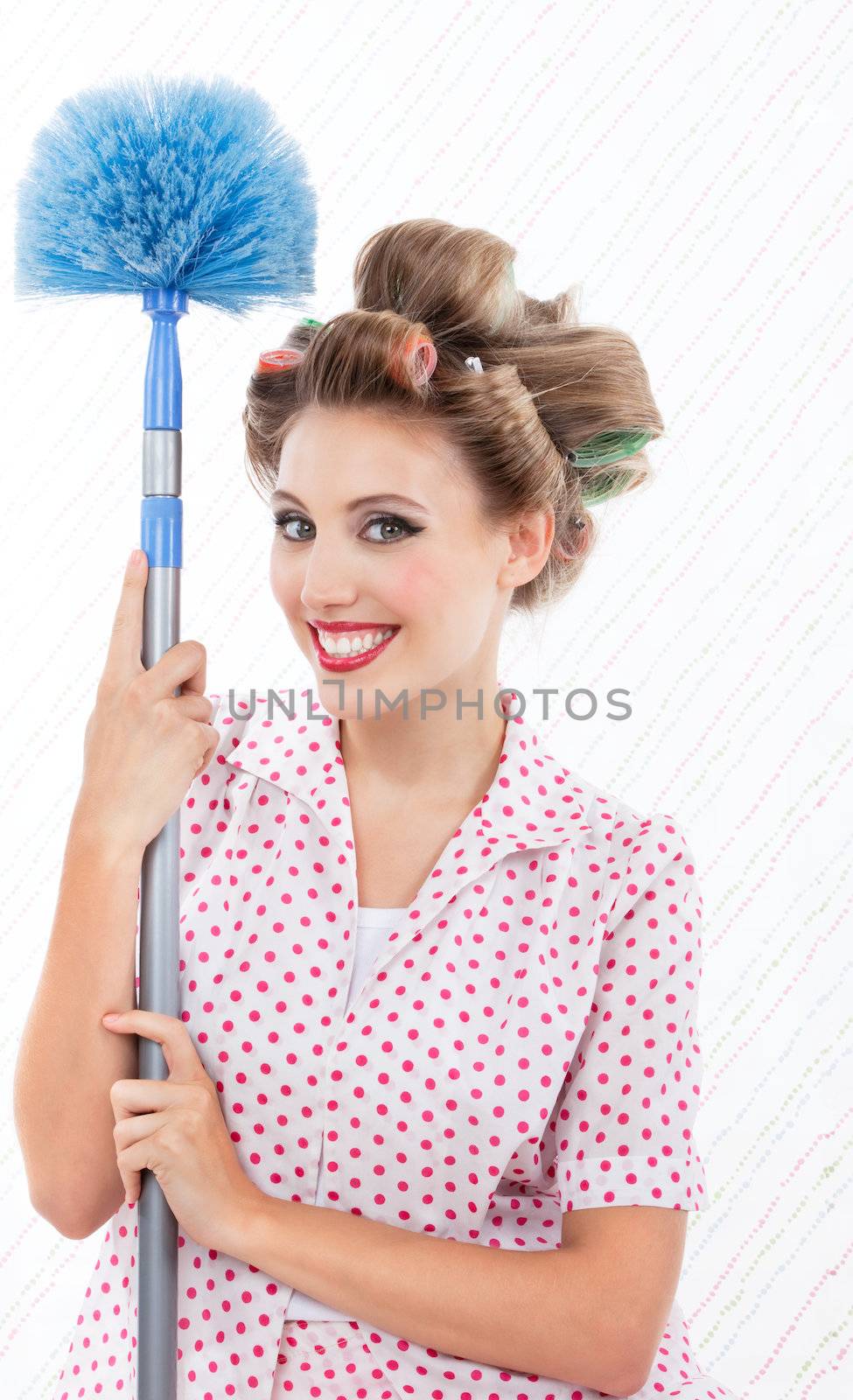 Portrait of attractive retro woman with duster