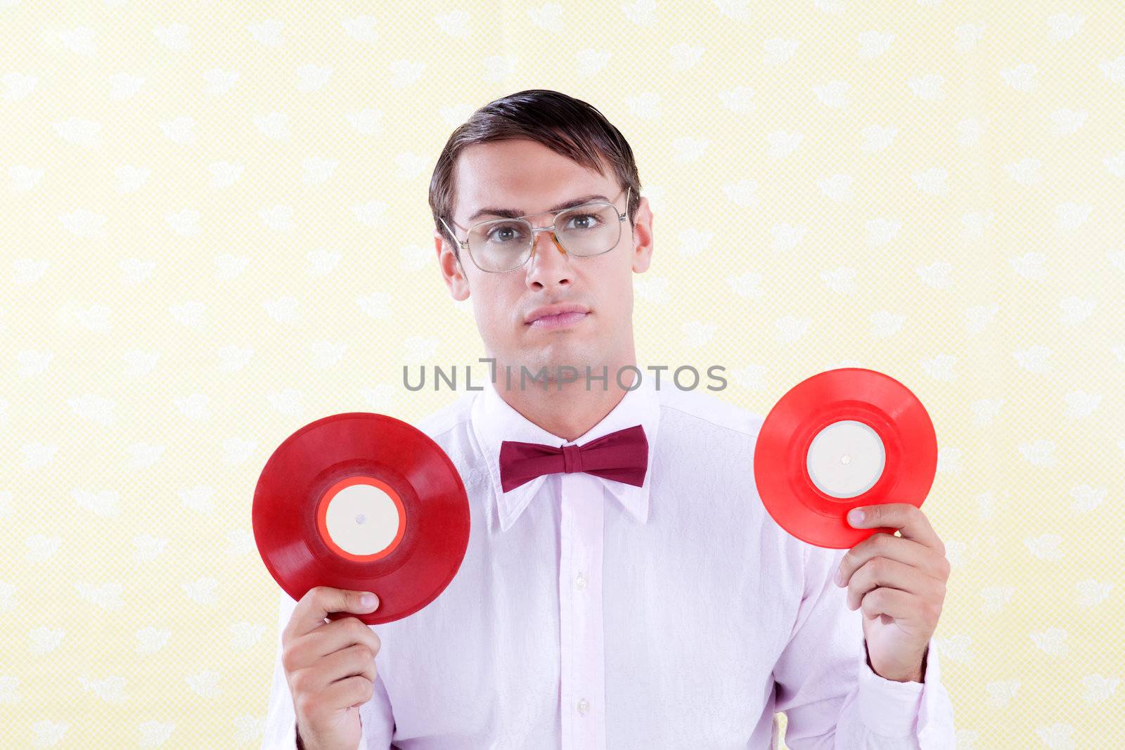 Retro style man holding vinyl record .