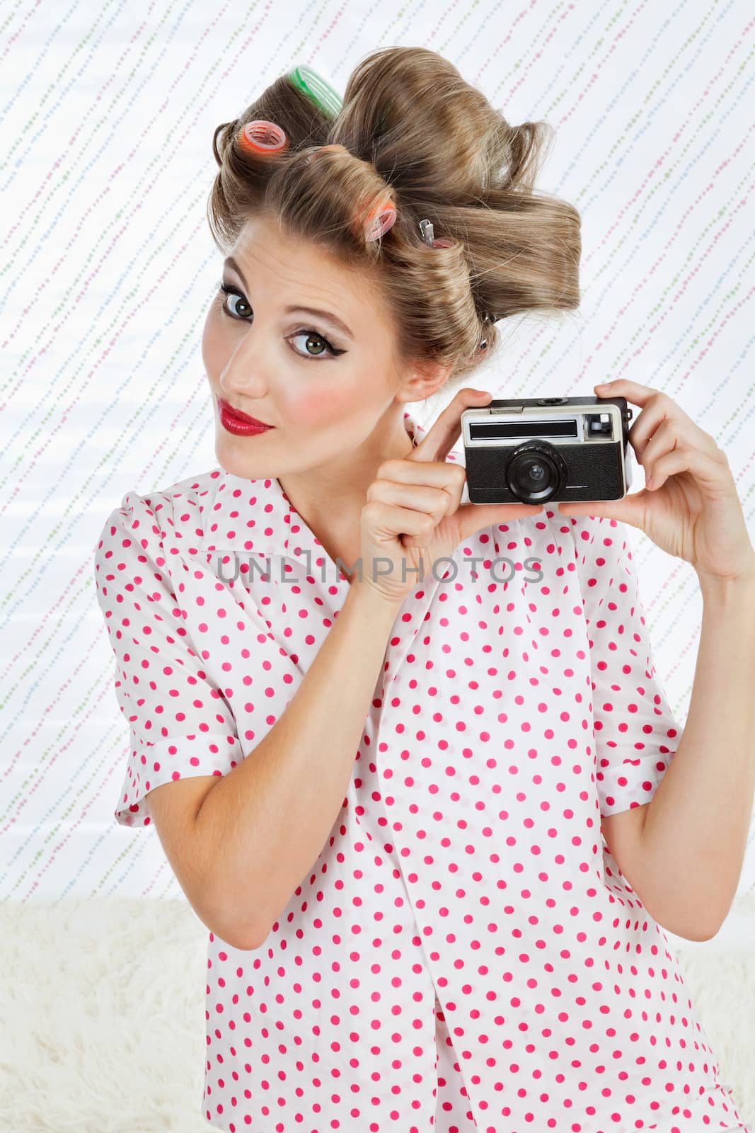 Woman Holding Vintage Camera by leaf