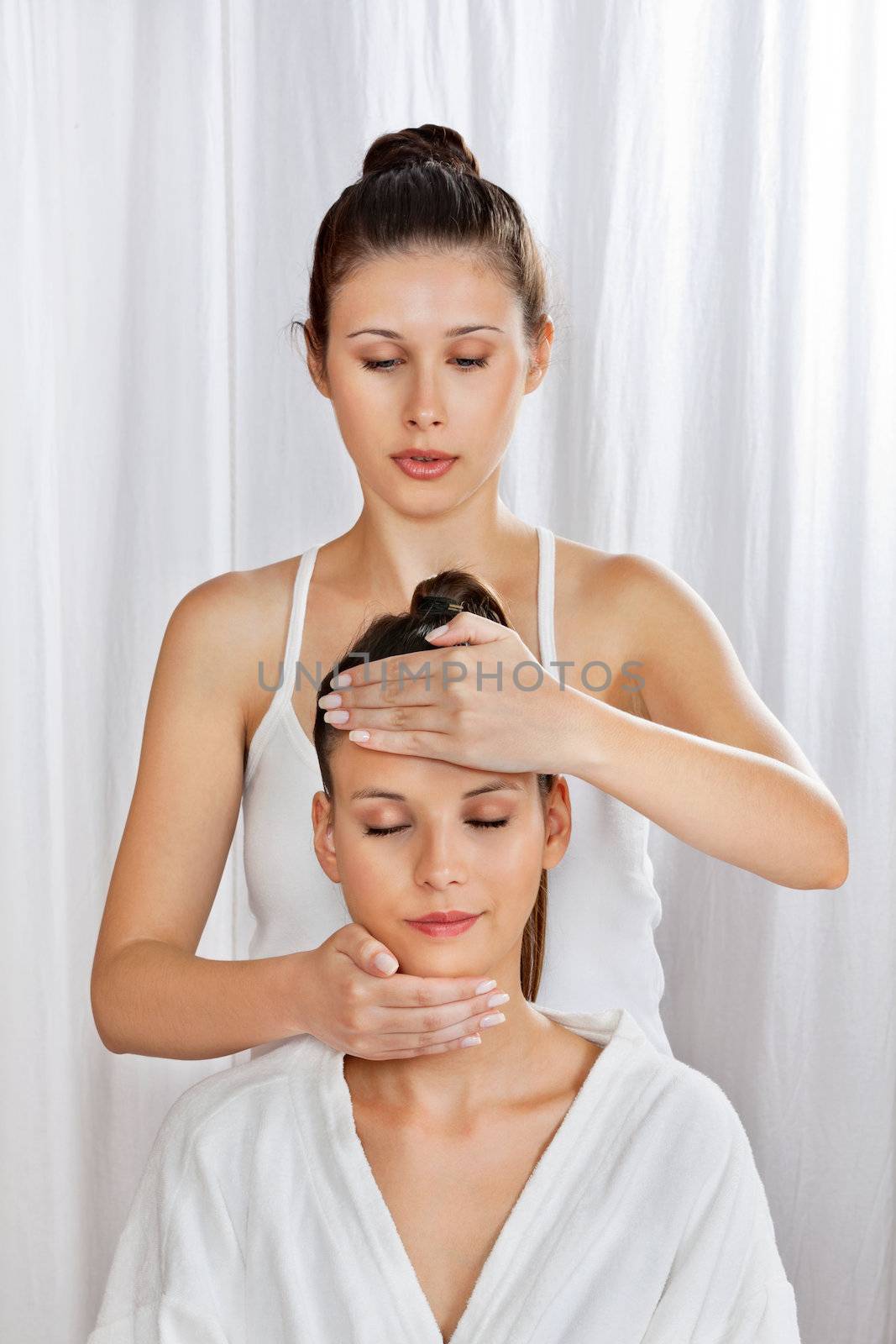 Masseuse Giving Head Massage To Woman by leaf