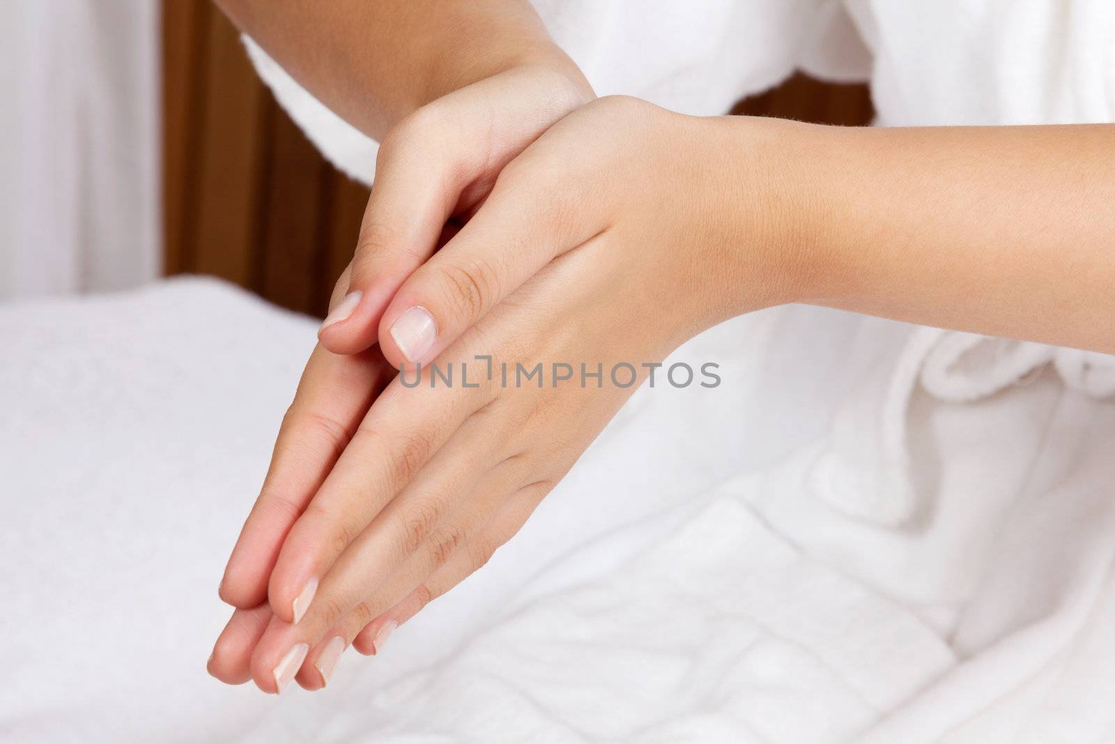 Cropped image of a woman with hands clasped