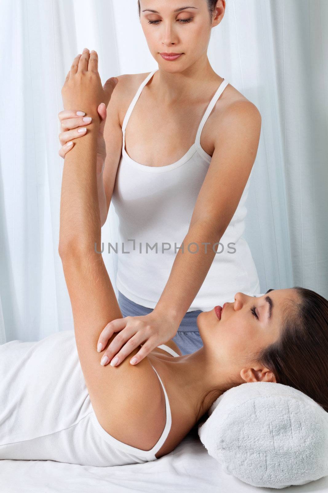 Woman Having An Arm Massage by leaf