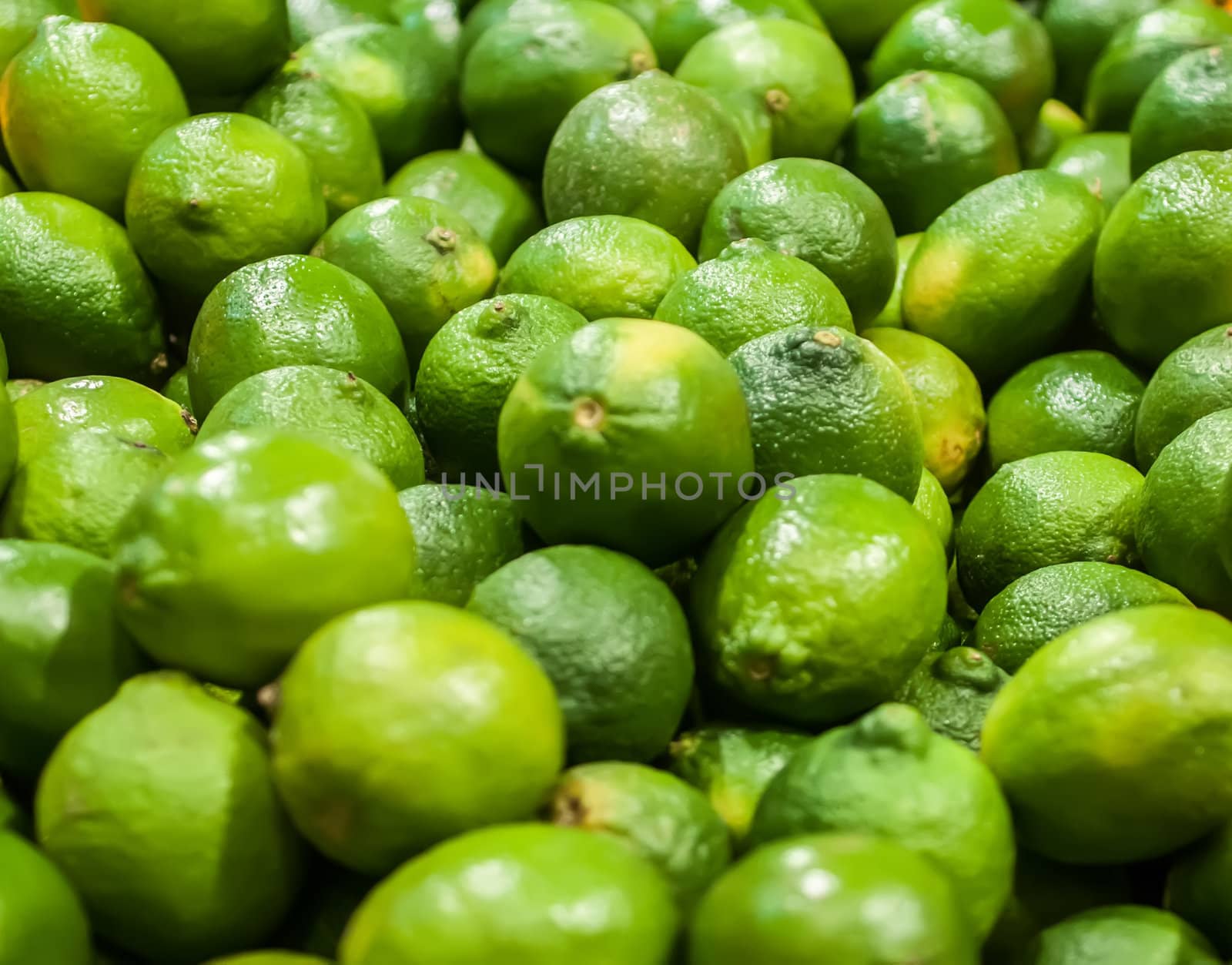 green lemon  on display at farmers market