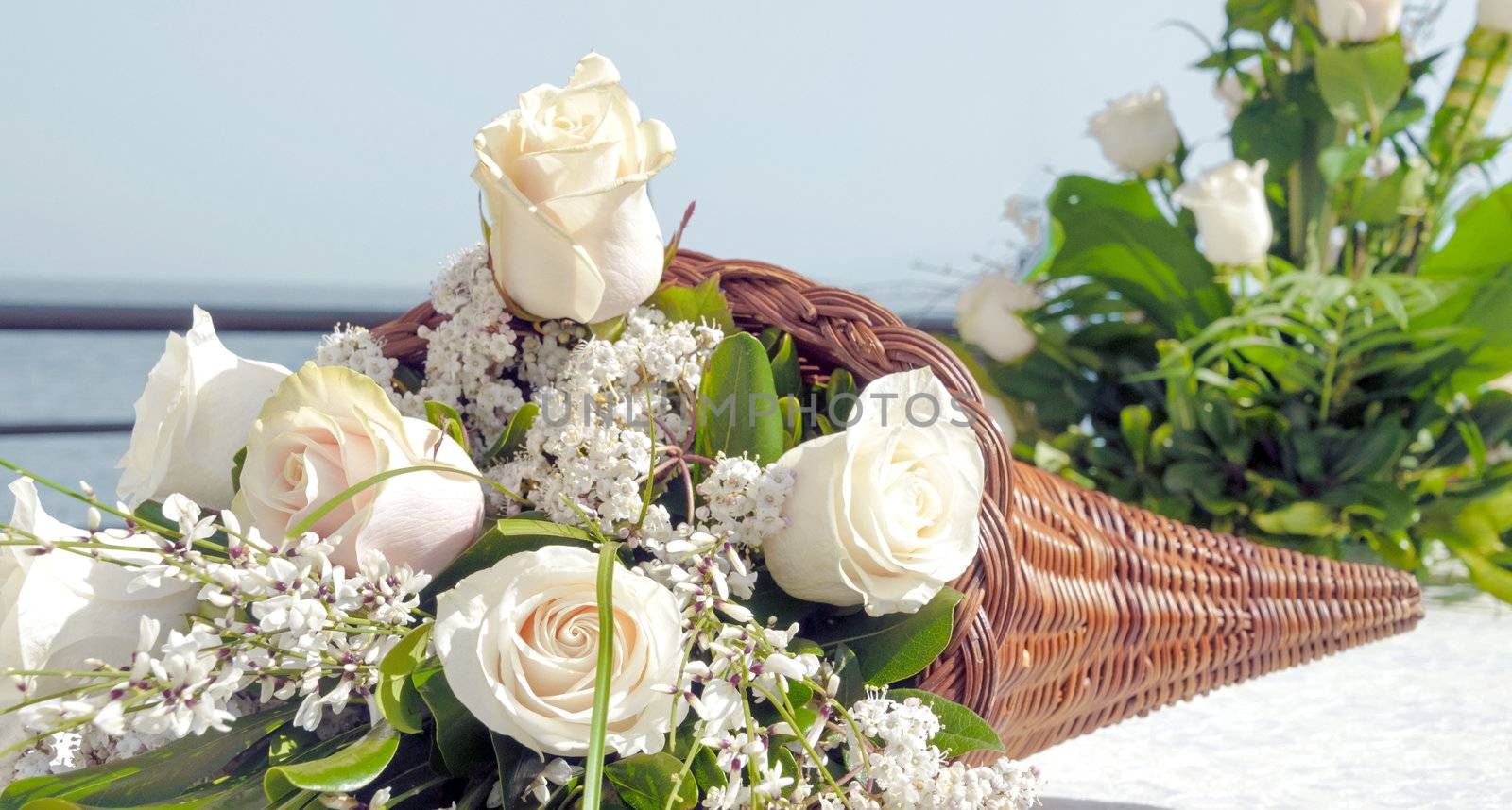 white rose bouquet on a table in wedding catering