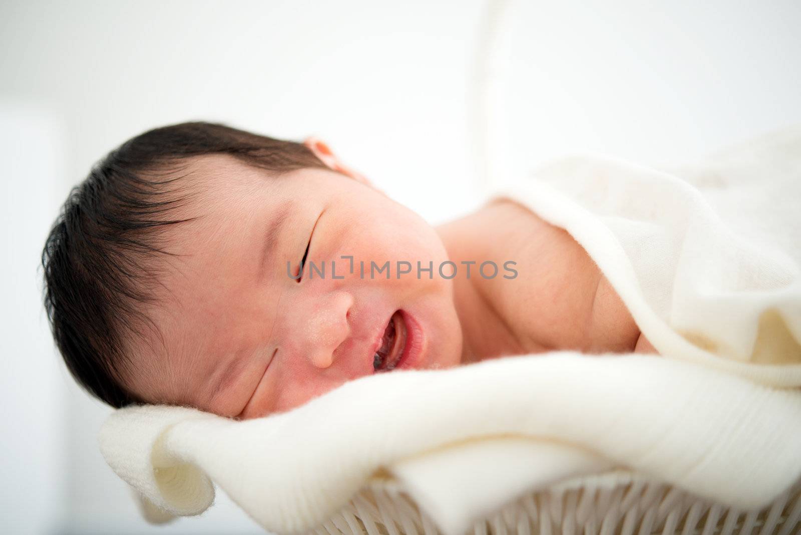 Newborn Asian baby girl smiling, 7 days after birth