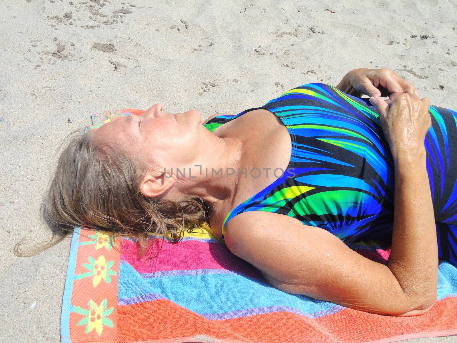 Mature female beauty on vacation at the beach.