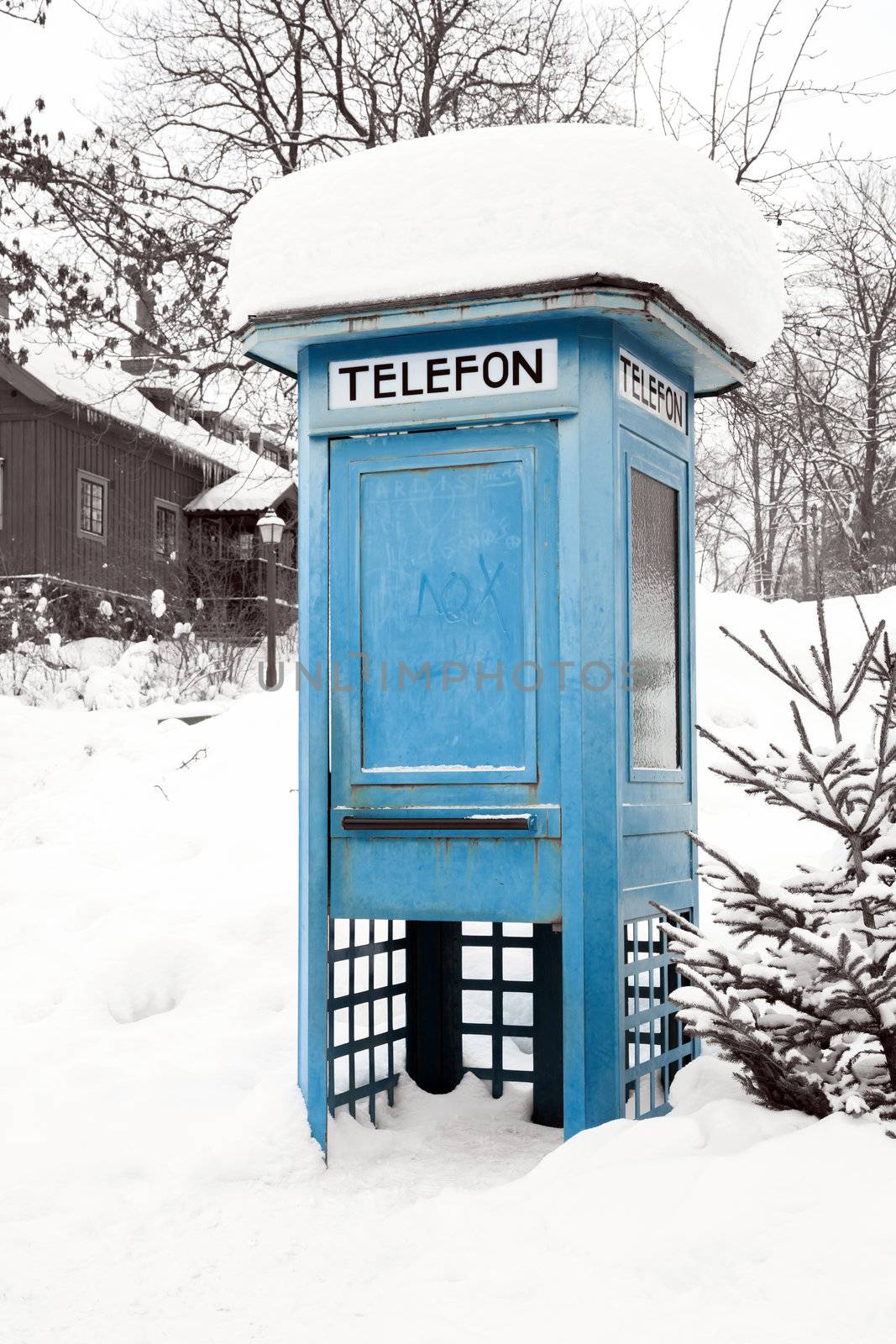 Blue Telephone Booth with snow in Stockholm Sweden