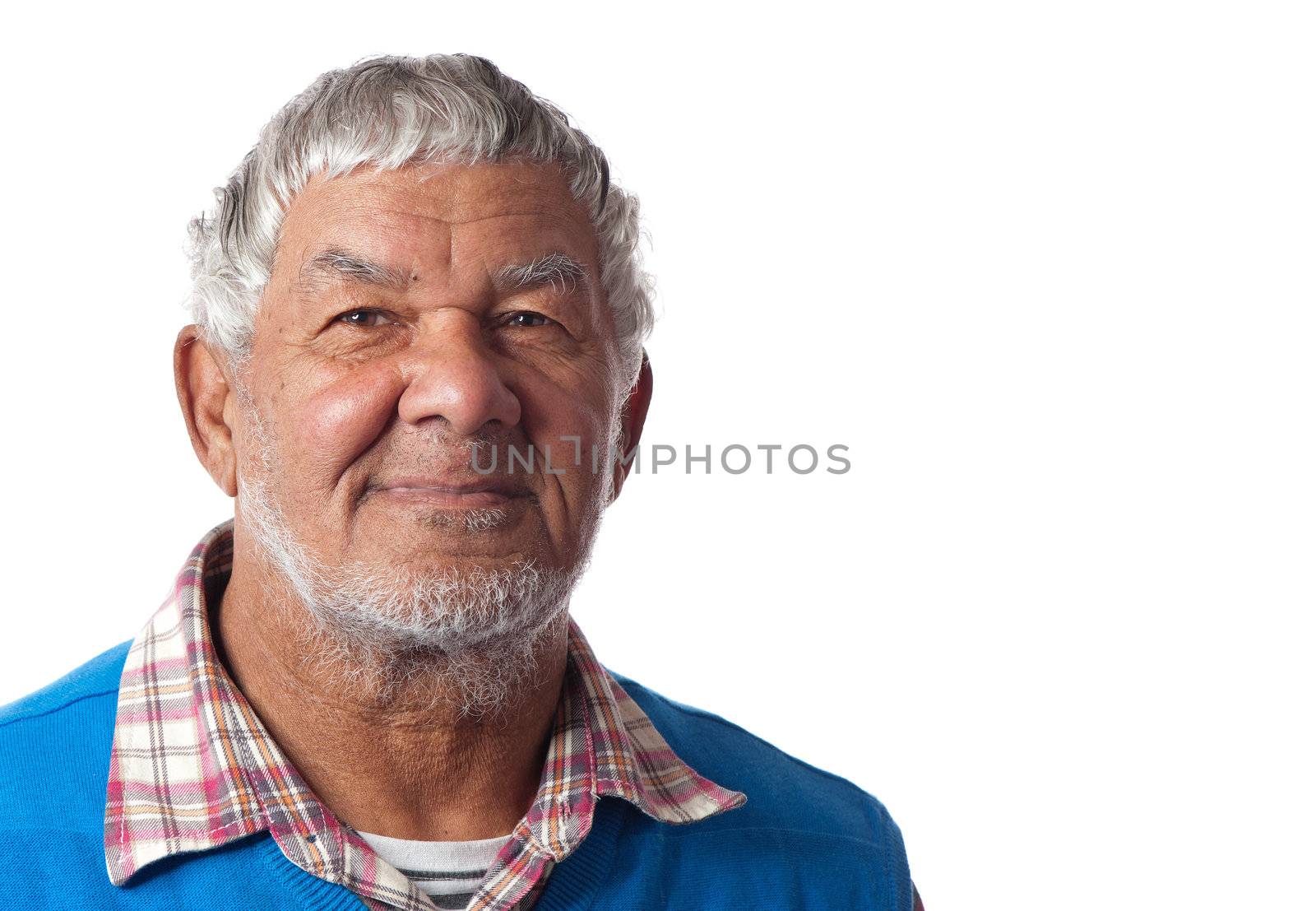 An elderly male appears relaxed and happy to grow old.