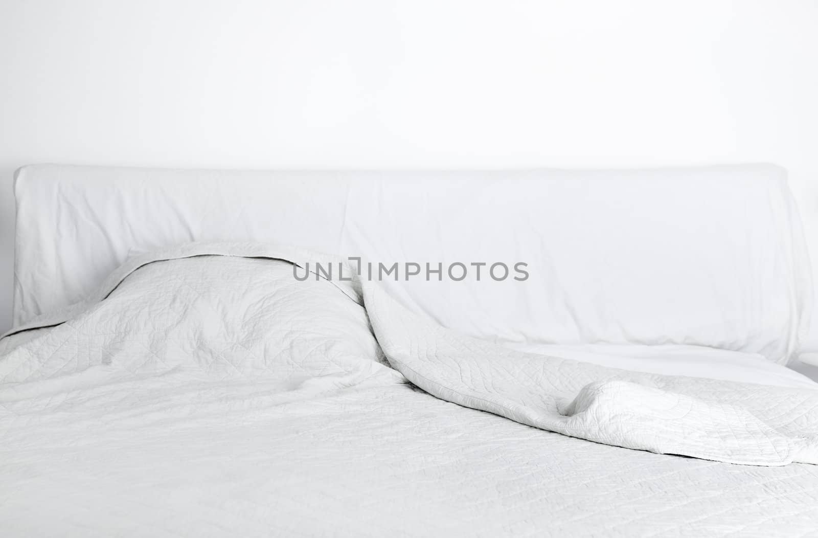 White doube bed in the bedroom