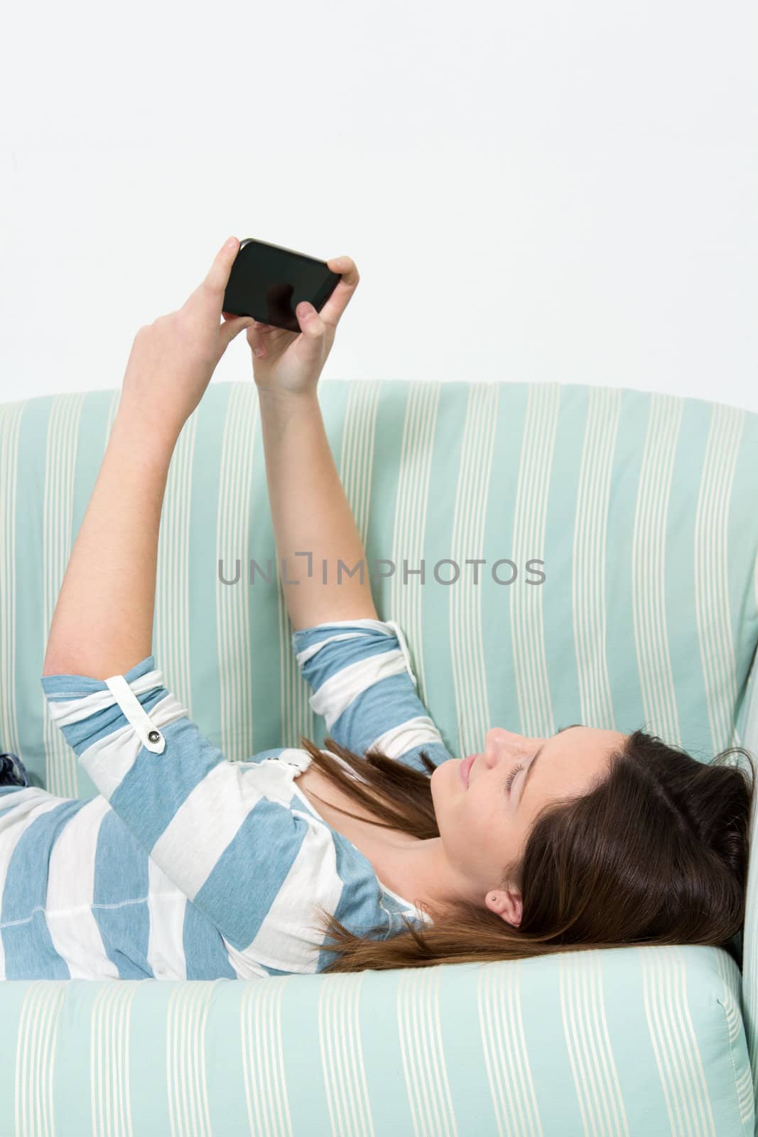 Brunette Girl using touchscreen of a Smartphone