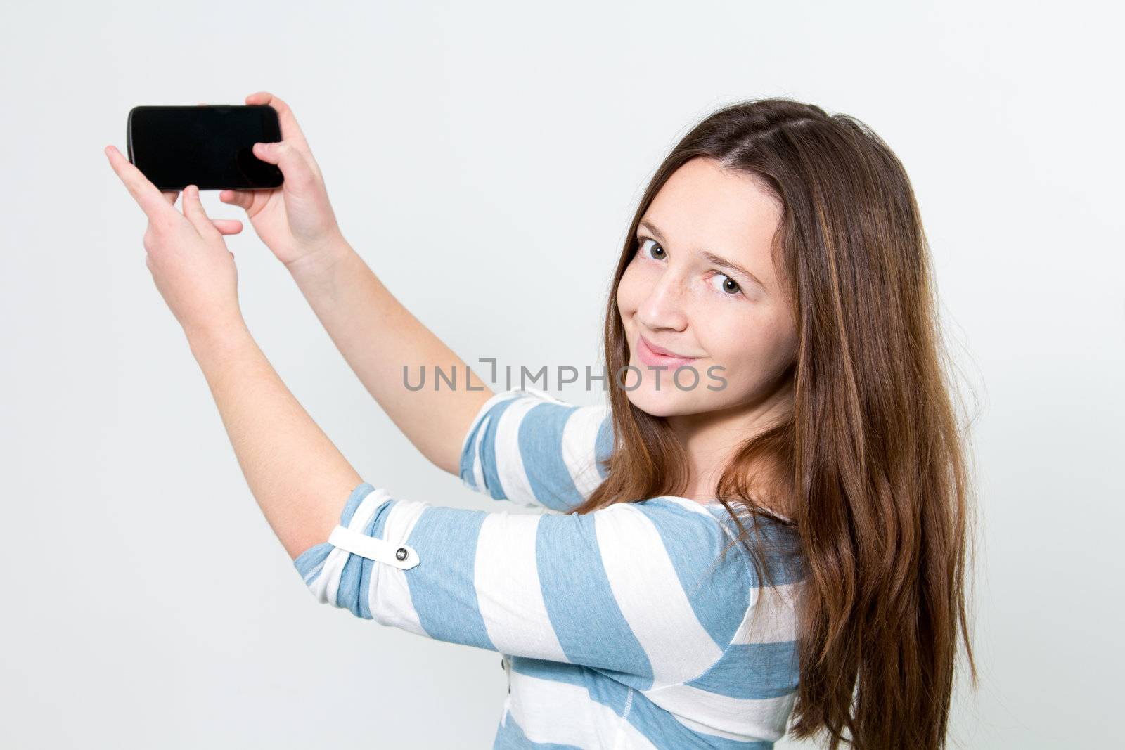 Brunette Girl using a Smartphone by dwaschnig_photo